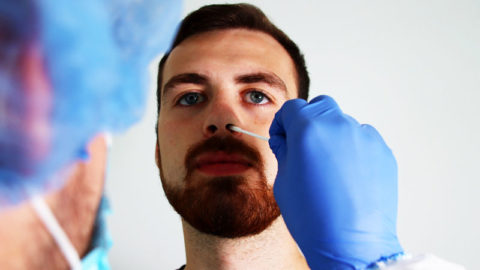 The doctor takes a sample from inside your nose using a swab. 