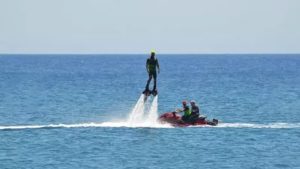 Dive and jump out of the water and perform various freestyle figures