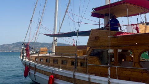 The elegant wooden sailing yacht in the port