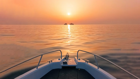Witness the stunning sunset from the bow of our luxury yacht