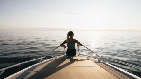 Enjoying a peaceful moment on the bow of the yacht during the sunset cruise