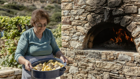 Yiayia ready to put the food in the wood oven