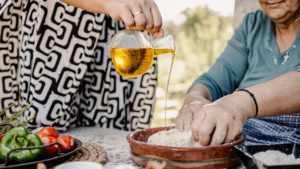 Adding olive oil in the traditional bread dough