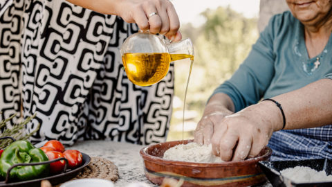 Adding olive oil in the traditional bread dough