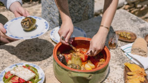 Stuffed tomatoes & bell peppers being served