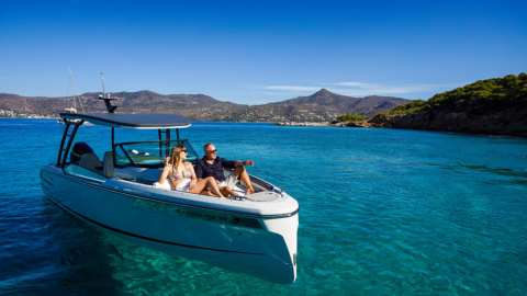 A couple enjoying a glass of chilled wine on board