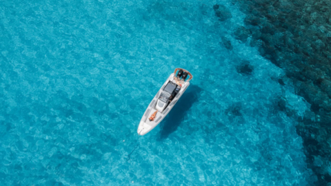 The RIB motorboat near the coastline